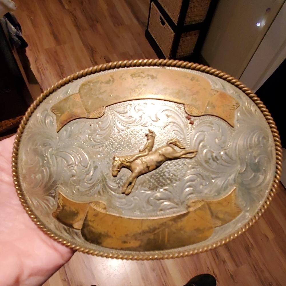 Bucking cowboy belt buckle.